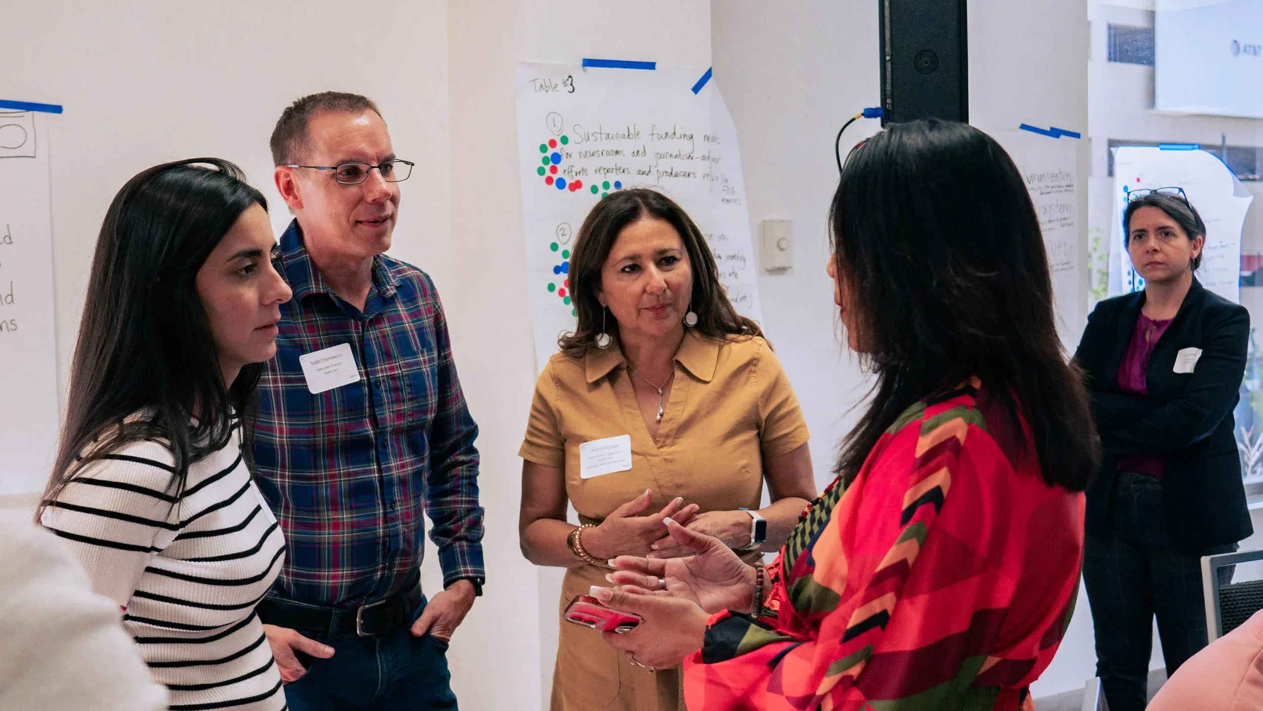 A group of people engaging in a conversation at the Colorado Media Project summit in 2024